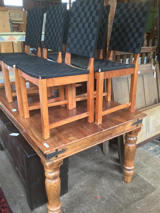 Teak dining table and six chairs(-)